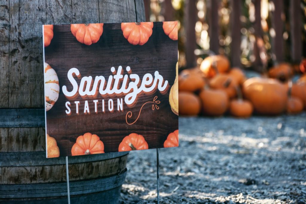 Celebrate Halloween Safely in your HOA/Condo during Covid-19 1 halloween covid 19 - image of pumpkins and a sanitizer station sign