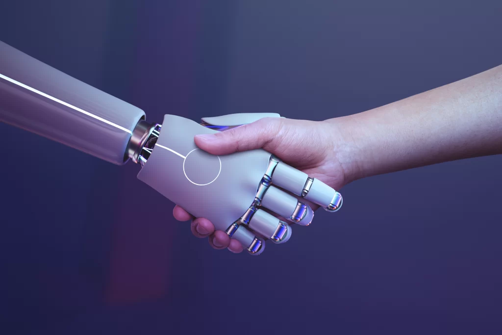 How AI & ChatGPT Can Transform HOA Management: Benefits, Risks & Best Uses 2 Symbolic image of two hands shaking, one represented as a human hand and the other as a robot hand, representing the potential of AI tools in HOA management