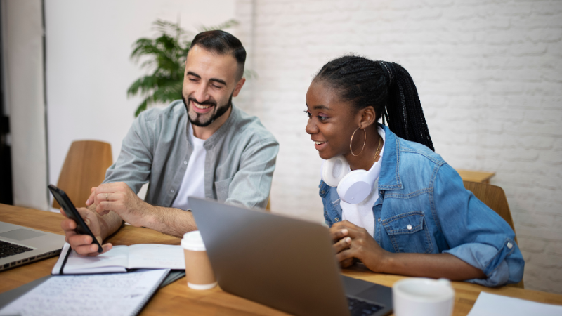 Discover The Top 5 HOA Management Companies in Houston, TX: The Right Fit For Your Community 1 Image of two people talking about the top 5 HOA Management Companies in Houston, TX.